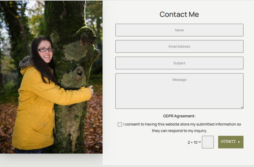 The Solas Relaxation contact page features an image of Katie wearing a bright yellow jacket. She is smiling facing the camera and hugging a tree.